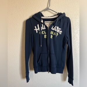 LIKE NEW Hollister size medium navy blue zip front hooded sweatshirt.